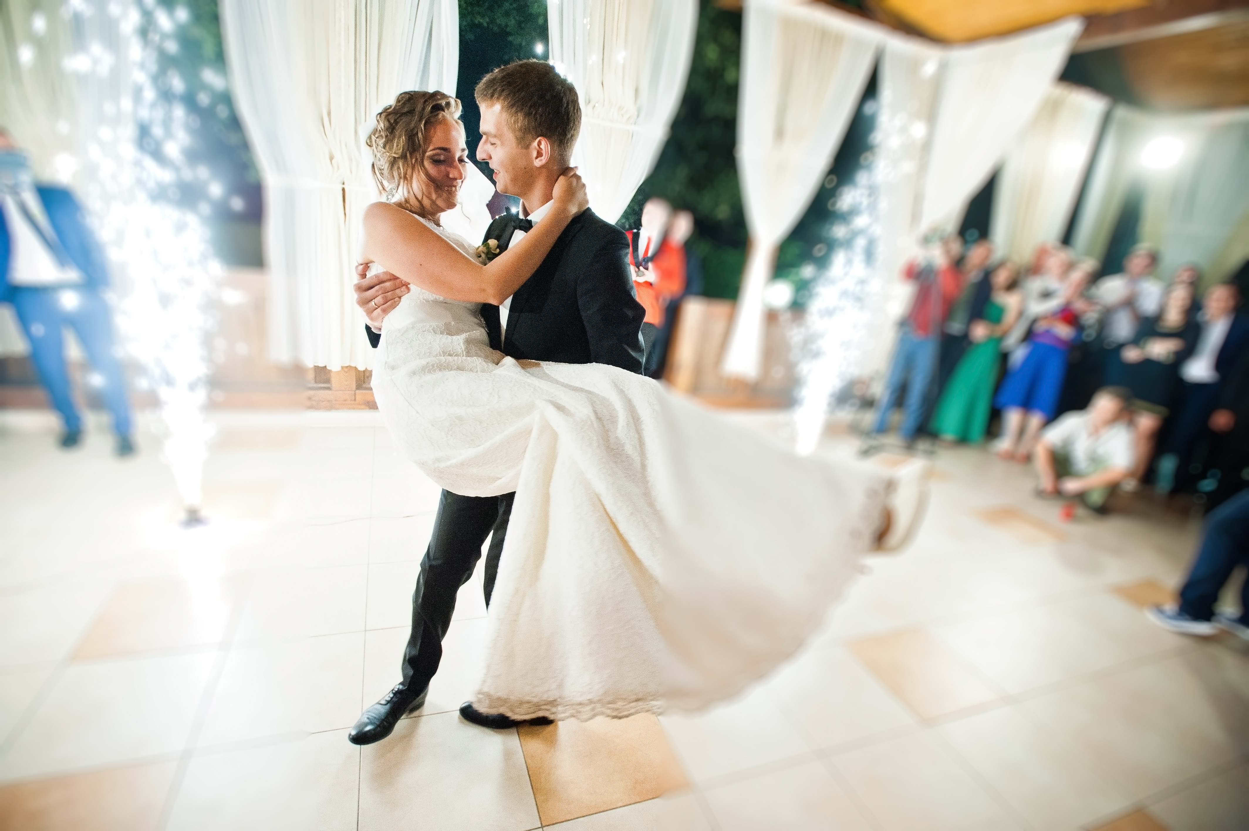 First wedding dance with fireworks of wedding couple. Photo with blur and noise